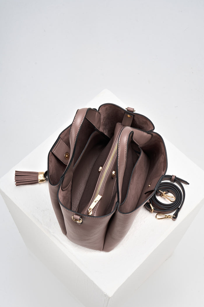 Overhead view of Etta Fawn faux leather Small Tote showing the inside and removable interior pouch with detachable crossbody strap rolled up next to the bag