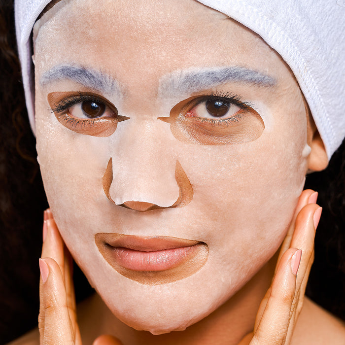 Model wearing a Rael sheet face mask.