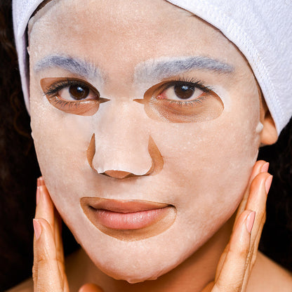 Model wearing a Rael sheet face mask.