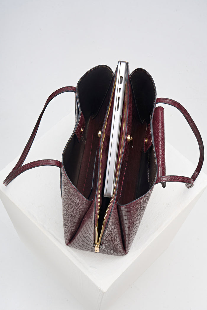 Overhead view of Francois Black Cherry Crocodile print faux leather Laptop Tote showing inside compartments and central laptop zipper compartment