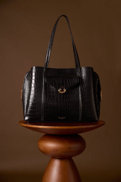 Francois Black Crocodile print faux leather Laptop Tote displayed on a brown wooden plinth