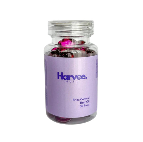 Jar of Harvee Hair Frizz Control Hair Oil on a light purple background