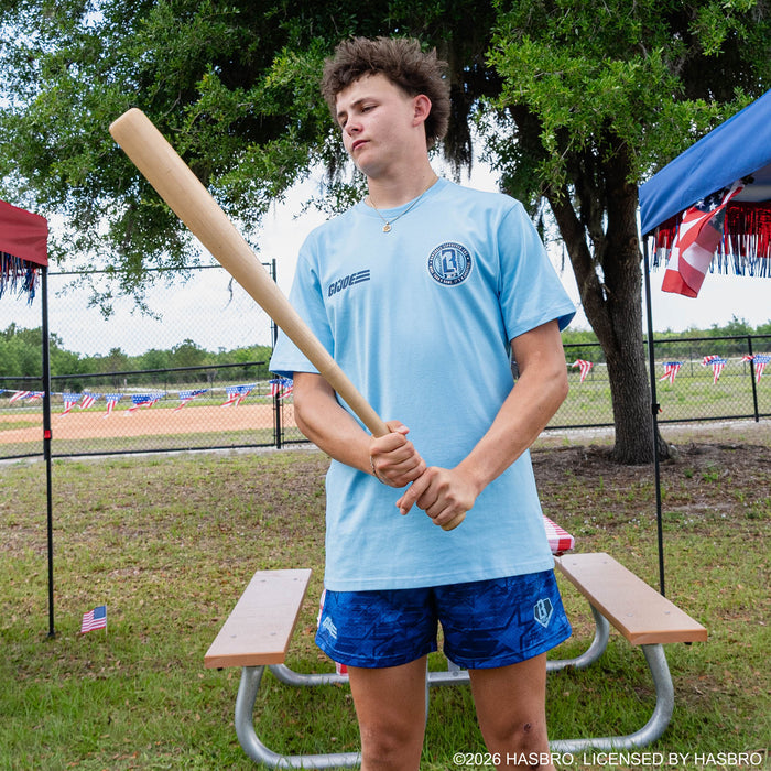 Adult model wearing blue shorts with “G.I. Joe Star” design