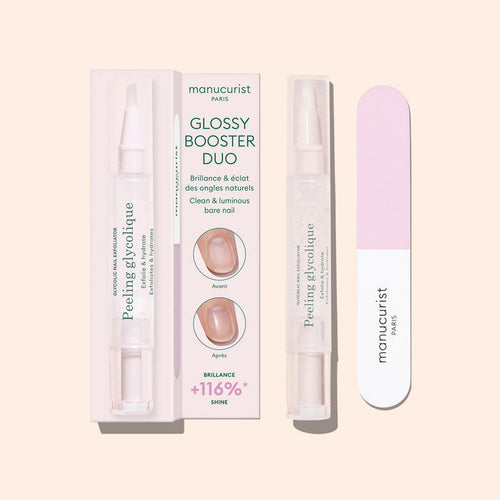 The Glossy Booster Duo by Manucurist includes a pink nail file and a pen-style nail exfoliator. Packaging features before-and-after images and product info in French and English.
