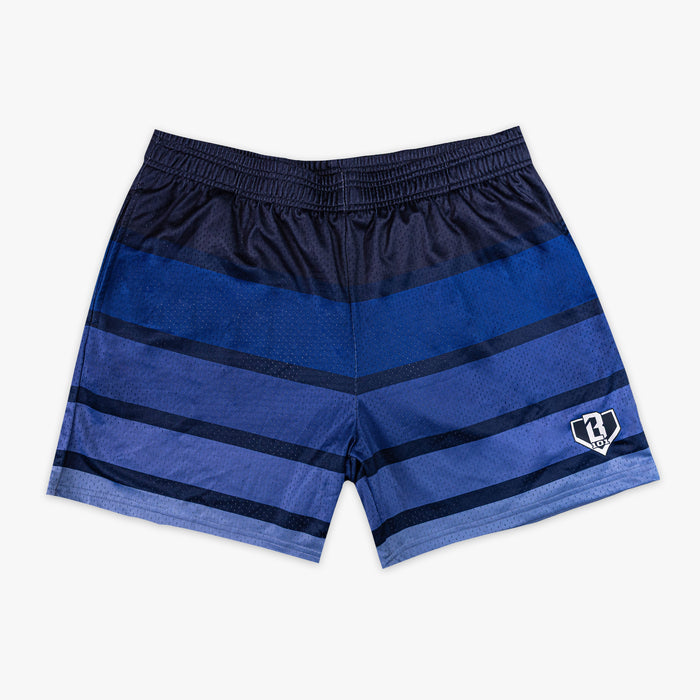 Front flat lay of BL101 navy and blue gradient stripe mesh shorts with a BL101 home plate logo, on a white background.