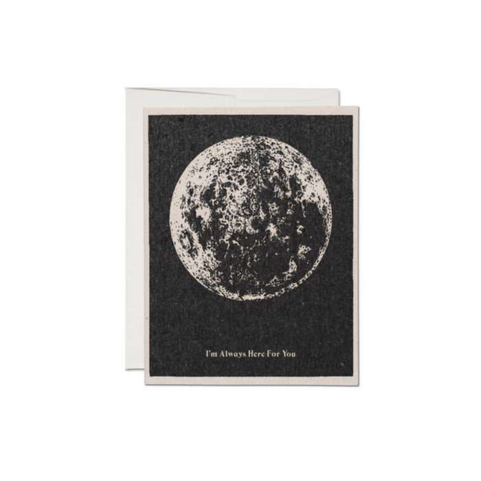 Dark moon greeting card with large white lunar illustration and small message at bottom