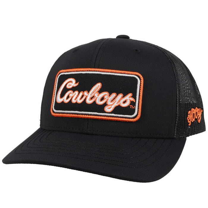 Hooey x Oklahoma State University Cowboys Black 6 panel snapback trucker cap with mesh back. Features a Cowboys patch on front and a small Hooey logo on side. Front view stock photo.