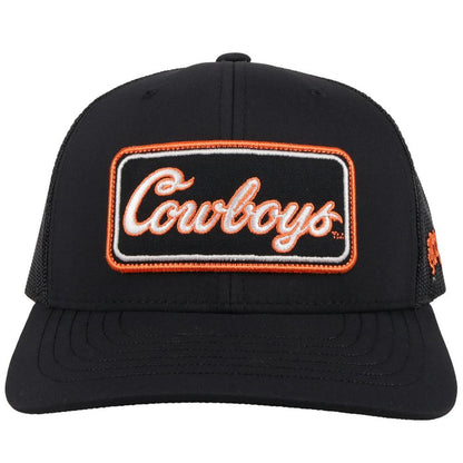 Hooey x Oklahoma State University Cowboys Black 6 panel snapback trucker cap with mesh back. Features a Cowboys patch on front and a small Hooey logo on side. Front view stock photo.