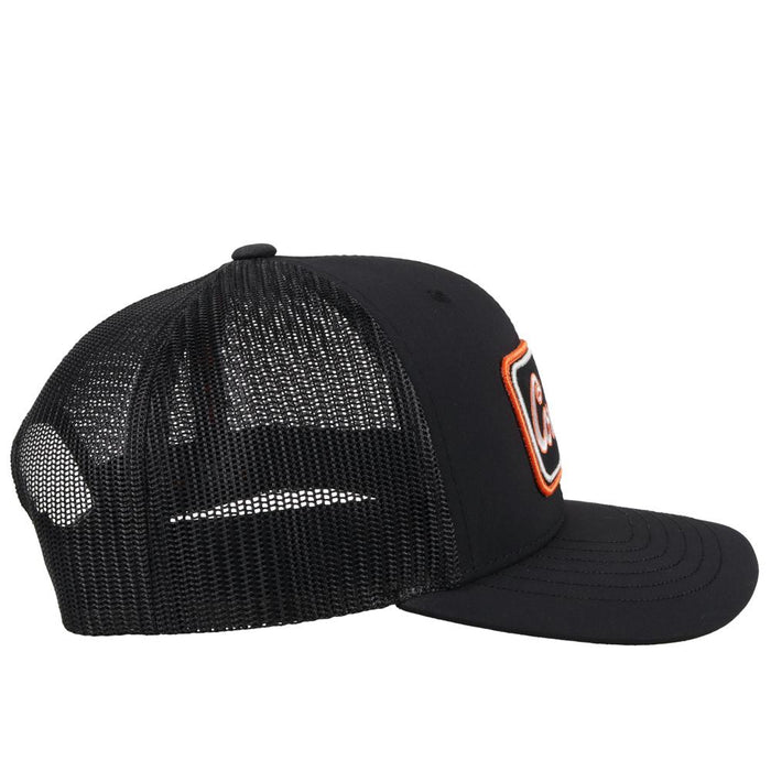 Hooey x Oklahoma State University Cowboys Black 6 panel snapback trucker cap with mesh back. Features a Cowboys patch on front and a small Hooey logo on side. Side view stock photo.