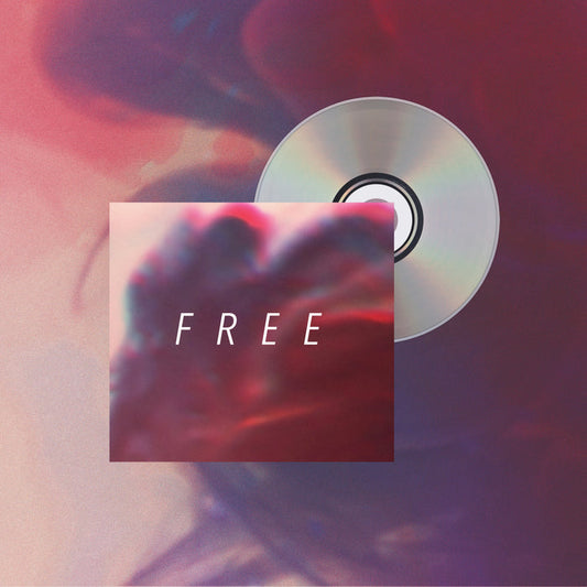 A Hundredth Free CD is partly hidden behind an album cover with a red-blue blurred abstract background. "FREE" appears in bold white letters, echoing the album's colors and hinting at its tracklist. Brand: Hundredth.