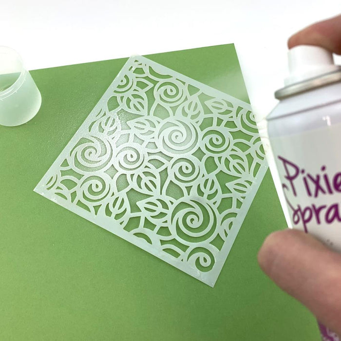 iCraft - Removable Pixie Spray For Stencils 3.8oz - Canada Version. Create flawless stenciled designs with Pixie Spray Stencil Adhesive! This light tack, repositionable adhesive gently holds stencils in place but wont tear paper or leave a sticky residue behind. Available at Embellish Away located in Bowmanville Ontario Canada.