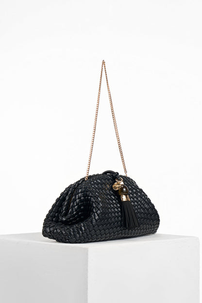 Side view of Indigo Black woven faux leather Oversized Clutch showing the gold clasp closure and detachable gold metal chain shoulder strap