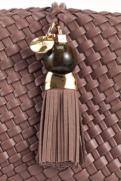 Close up shot of the Thames Tassel closre detail on Indigo Pecan woven faux leather Oversized Clutch
