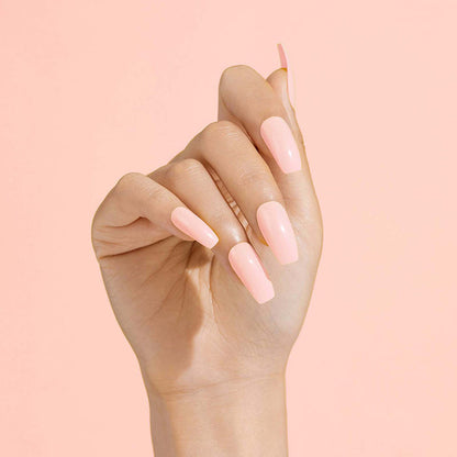 IVY BEAUTY by KISS long glossy coffin shape pale pink press on nails on model hand photo