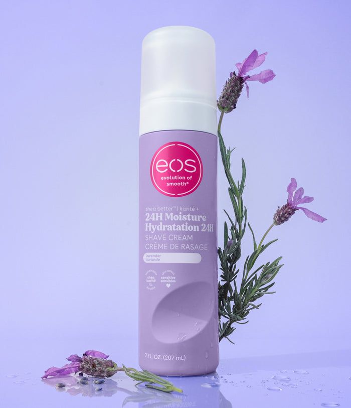 Eos 24H Moisture Hydration cream bottle with lavender flowers on a purple background