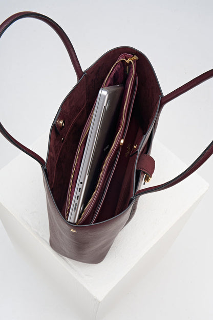 Overhead view of Lilibet Black Cherry faux leather Laptop Tote showing the detachable top zip laptop pocket and faux suede lining