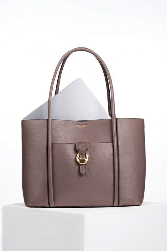 Front of Lilibet Fawn faux leather Laptop Tote with a laptop in the top showing molten metal Cannon Street Clasp closure on front slip-in pocket