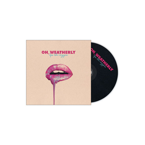 A CD case and disc for Oh, Weatherly's album "Lips Like Oxygen," featuring glossy pink lips with dripping paint on a beige background, plus the album title and band name in bold lettering.