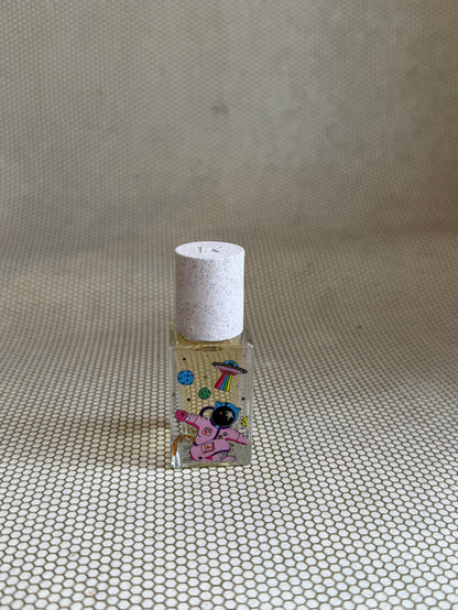 Maison Matine perfume with pink astronaut picture on glass bottle.