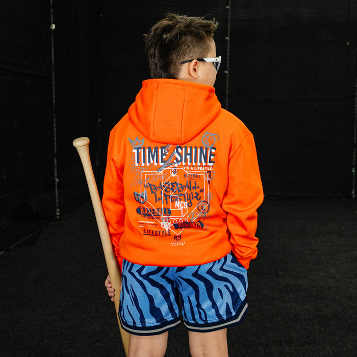 Youth model wearing blue Max Clark Tiger Court youth shorts