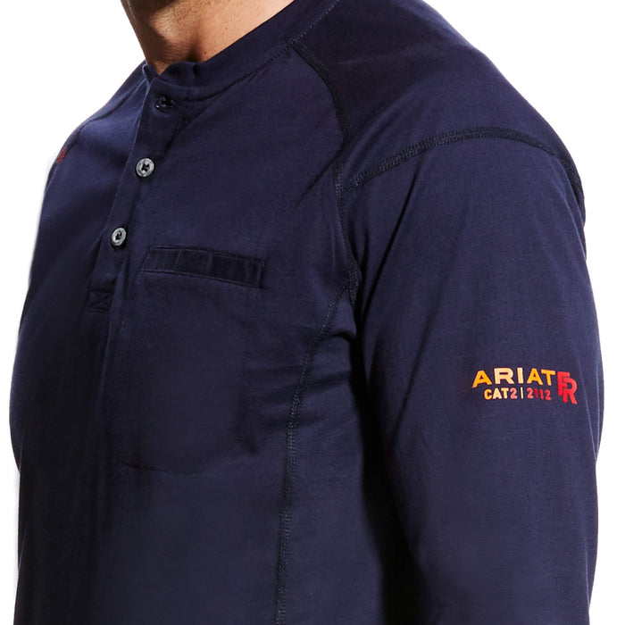 Men's Ariat FR long sleeve work shirt in Navy. Close up view of left arm showing Ariat FR CAT2 graphic print. Also shows left chest pocket.