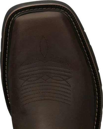 A toe view of a pair of Justin Men's Driller Brown Square Toe Work Boots.