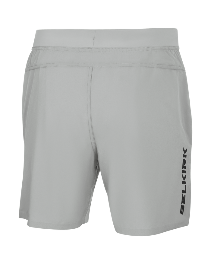 Rear view light gray athletic shorts with elastic waistband and vertical 'SELKIRK' logo on right leg.