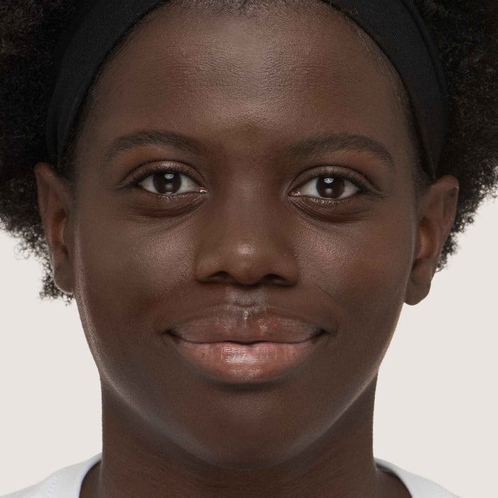 An image of a woman wearing FlexShade Foundation by No Makeup Makeup in Deep