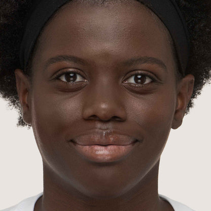 An image of a woman wearing FlexShade Foundation by No Makeup Makeup in Deep