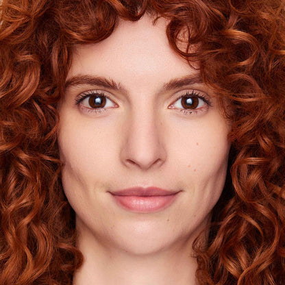 An image of a woman wearing FlexShade Foundation by No Makeup Makeup in Fair
