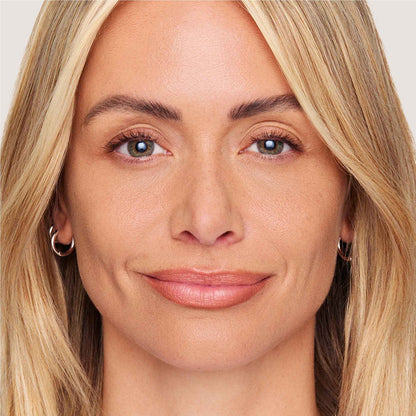 An image of a woman wearing FlexShade Foundation by No Makeup Makeup in Natural