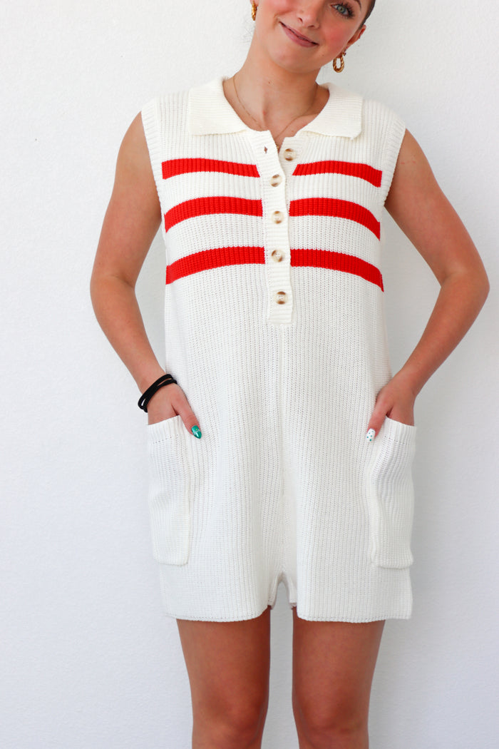 girl wearing cream and red knit short romper