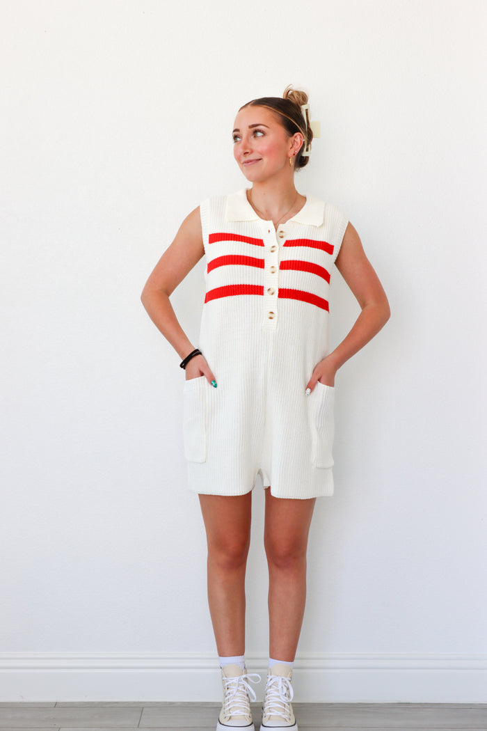 girl wearing cream and red knit short romper