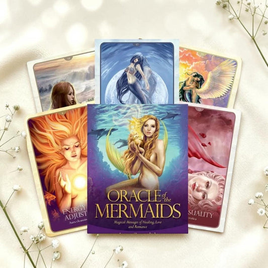 Oracle cards featuring mermaids on a light background with flowers.