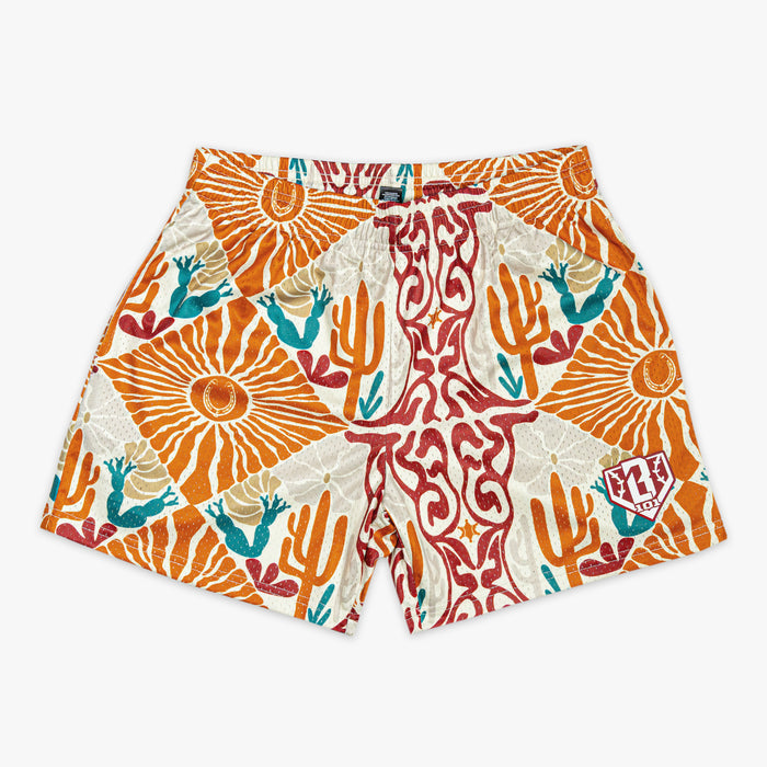 Colorful cactus patterned shorts on a white background