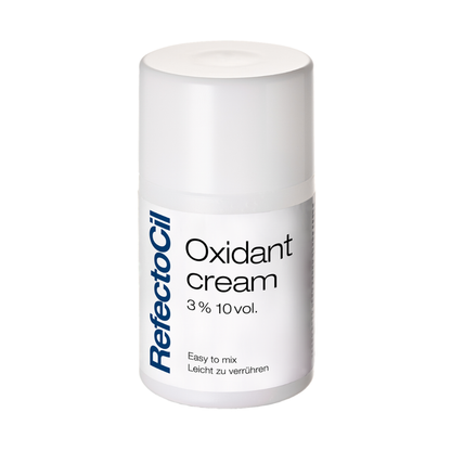 F003F Refectocil Eyelash Tint Oxidant Cream | A white cylindrical bottle of RefectoCil Oxidant cream 3% 10vol. on a plain white background.