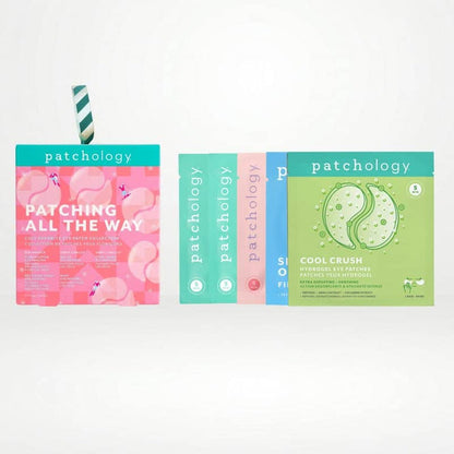 Eye patch packaging arranged on a white background, including a pink flamingo-themed box with a striped straw and two vertical boxes in teal, pink, and light blue eye masks.