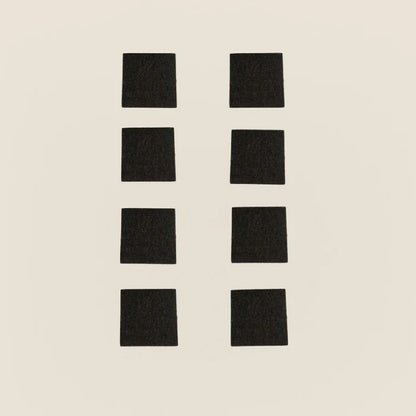 Set of eight black non-slip rubber pads for Gratz Pilates equipment feet.
