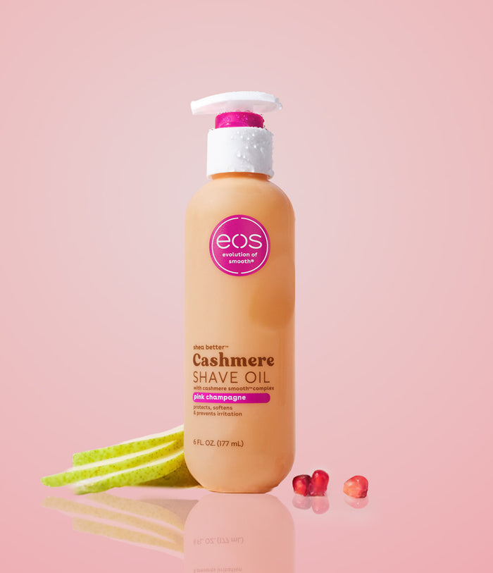 Bottle of eos Cashmere Shave Oil on a pink background