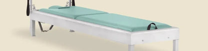 Fjord blue pre-stitched upholstery fitted on a Gratz Pilates Instant Cadillac insert bed.