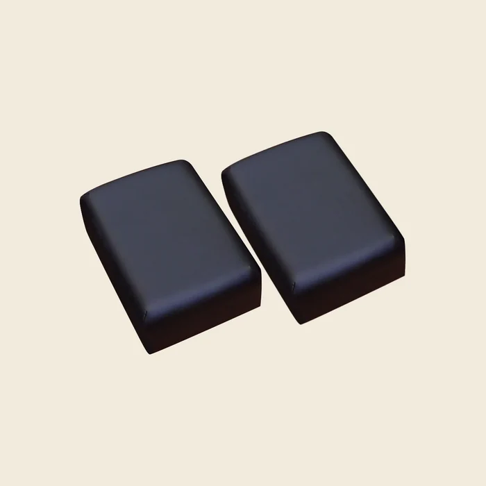 Pair of black pre-stitched upholstery covers for Gratz Pilates Moon Boxes on beige.