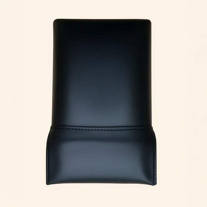 Black pre-stitched upholstery for a Gratz Pilates Reformer headrest on cream background.