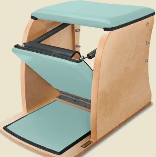 Fjord blue pre-stitched upholstery installed on a wooden Pilates Wunda Chair.