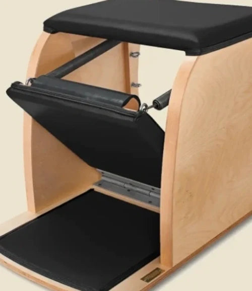 Black pre-stitched upholstery fitted to a wooden Gratz Wunda Chair seat and pedal.