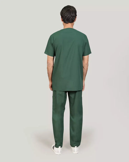 Rear view of a male medical professional wearing a hunter green Medfit scrub set, showcasing the full design and comfortable fit for healthcare workers.