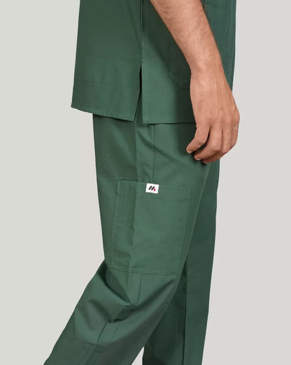 Detail shot of hunter green Medfit men's scrub pants, featuring a practical cargo pocket and the distinct Medfit logo, ideal for medical professionals.