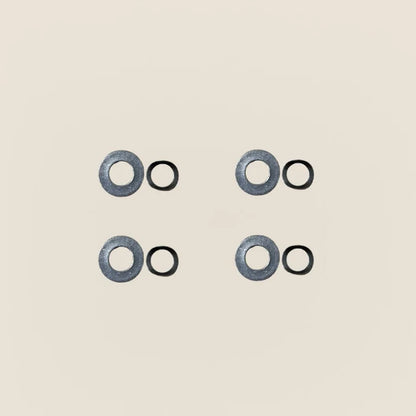 Four Gardner springs paired with four flat washers for Pilates Reformer guide wheels.