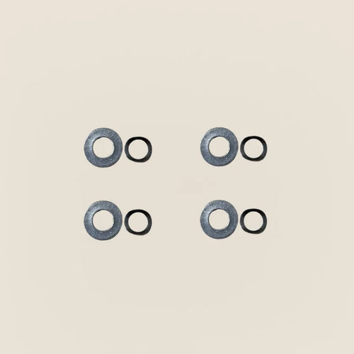 Four Gardner springs paired with four flat washers for Pilates Reformer guide wheels.