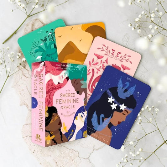 Set of colorful oracle cards on a light background with flowers
