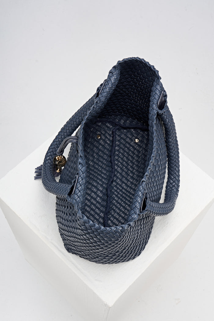 Overhead view of the inside of Saskia Denim Blue faux leather Woven Tote